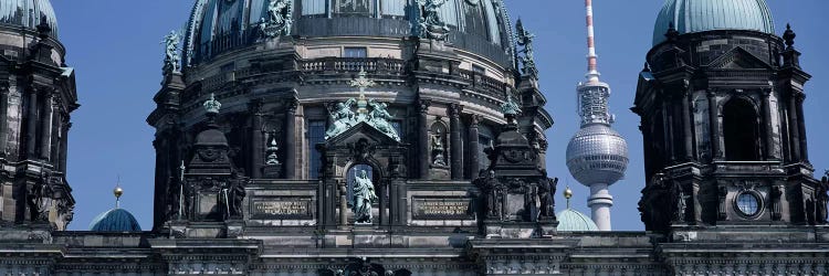 Low angle view of a church, Berliner Dom, with Television Tower (Fernsehturm) in distance, Berlin, Germany