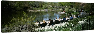 Group of people sitting on benches near a pond, Central Park, Manhattan, New York City, New York State, USA Canvas Art Print - Spring Art