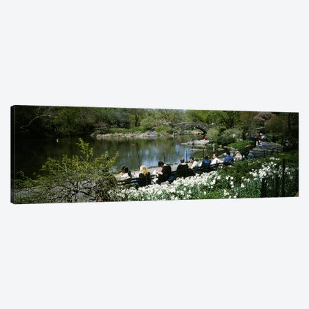 Group of people sitting on benches near a pond, Central Park, Manhattan, New York City, New York State, USA Canvas Print #PIM5142} by Panoramic Images Art Print