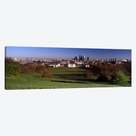 Distant View Of Canary Wharf On The Isle Of Dogs From Greenwich Park, London, England Canvas Print #PIM5226} by Panoramic Images Canvas Art Print