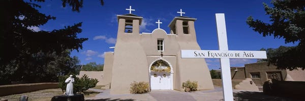 Taos: Cross in front of a church, San Francisco de Asis Church, Ranchos De Taos, New Mexico, USA by Panoramic Images