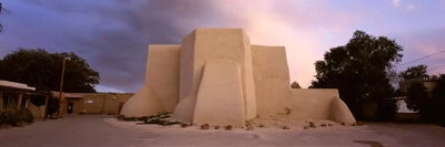 Overcast clouds sky over a church, San Francisco de Asis Church, Ranchos De Taos, New Mexico, USA by Panoramic Images canvas print
