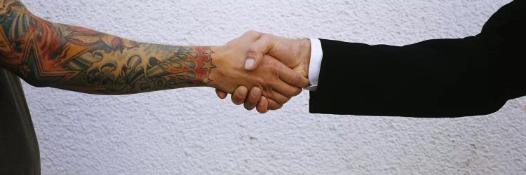 Close-Up Of Two Men Shaking Hands