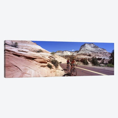 Two people cycling on the road, Zion National Park, Utah, USA Canvas Print #PIM5312} by Panoramic Images Canvas Artwork