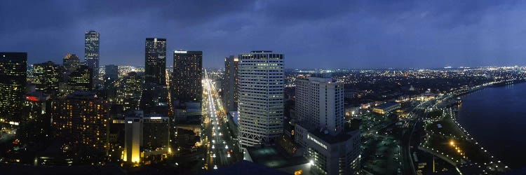 High angle view of buildings in a city lit up at night, New Orleans, Louisiana, USA