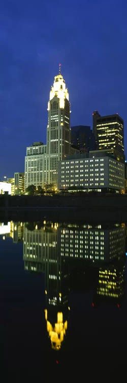 Buildings in a city lit up at night, Scioto River, Columbus, Ohio, USA by Panoramic Images wall art