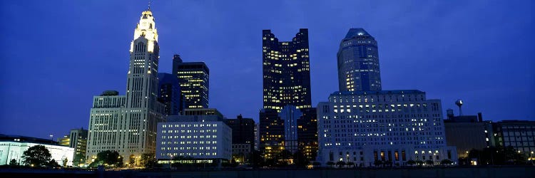 Low angle view of buildings lit up at night, Columbus, Ohio, USA