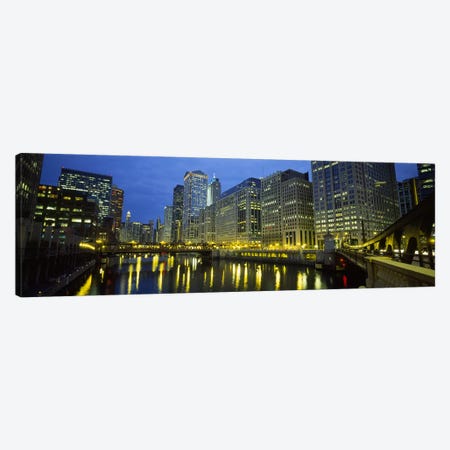Low angle view of buildings lit up at night, Chicago River, Chicago, Illinois, USA Canvas Print #PIM5451} by Panoramic Images Canvas Print