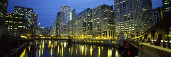 Chicago: Low angle view of buildings lit up at night, Chicago River, Chicago, Illinois, USA by Panoramic Images