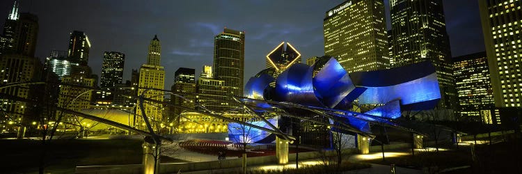 Low angle view of buildings lit up at night, Pritzker Pavilion, Millennium Park, Chicago, Illinois, USA