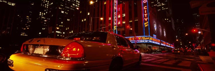 Car on a road, Radio City Music Hall, Rockefeller Center, Manhattan, New York City, New York State, USA