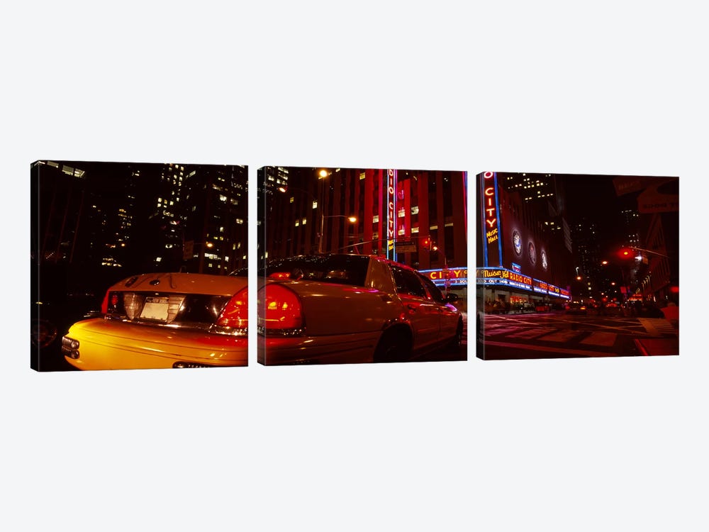 Car on a road, Radio City Music Hall, Rockefeller Center, Manhattan, New York City, New York State, USA by Panoramic Images 3-piece Canvas Print