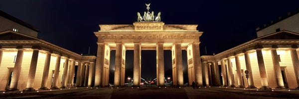 Germany: Low angle view of a gate lit up at night, Brandenburg Gate, Berlin, Germany by Panoramic Images