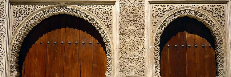 Low angle view of carving on arches of a palace, Court Of Lions, Alhambra, Granada, Andalusia, Spain