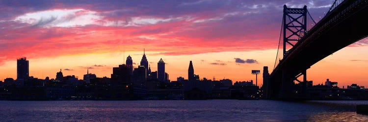 Silhouette of a suspension bridge across a river, Ben Franklin Bridge, Delaware River, Philadelphia, Pennsylvania, USA