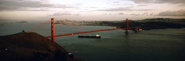 Barge passing under a bridge, Golden Gate Bridge, San Francisco, California, USA