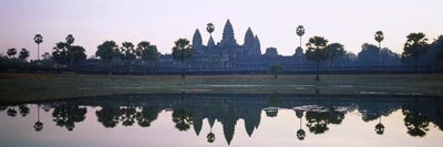 Reflection of temples and palm trees in a lake, Angkor Wat, Cambodia by Panoramic Images canvas print