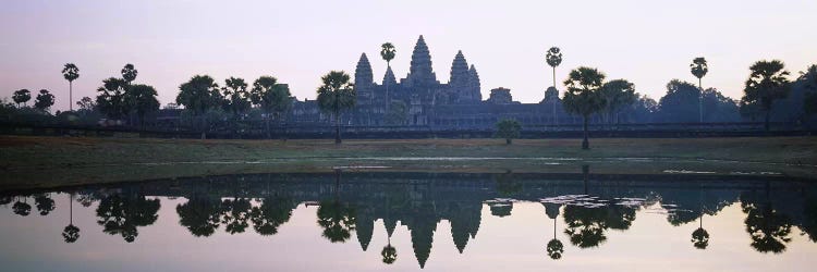 Reflection of temples and palm trees in a lake, Angkor Wat, Cambodia