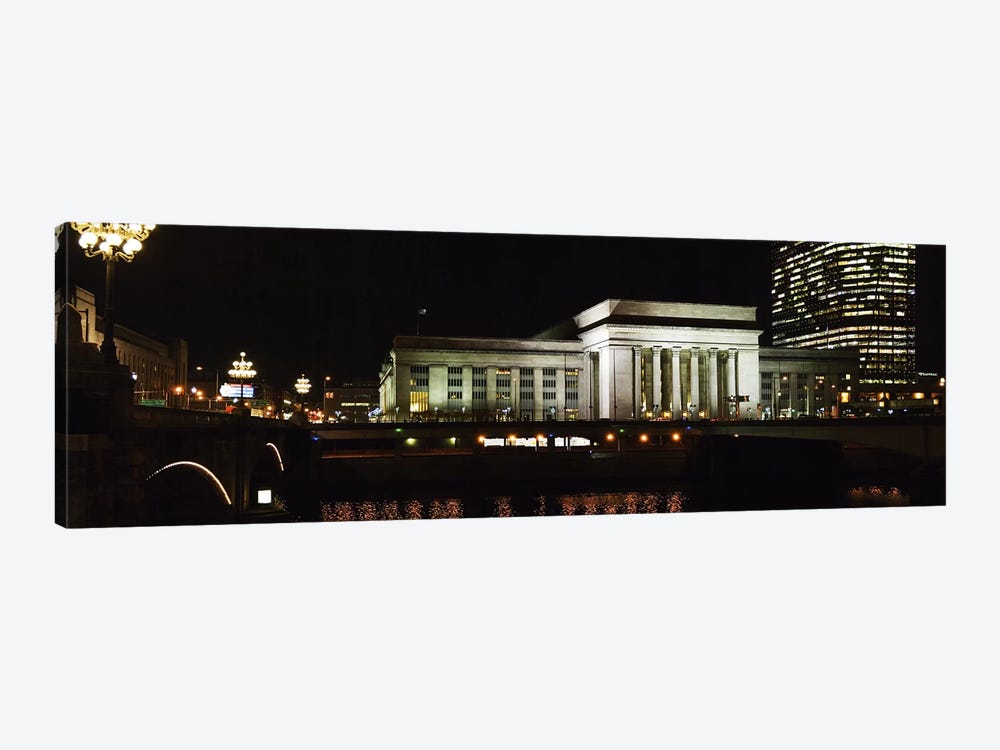 Buildings lit up at night at a railroad station, 30th Street Station, Schuylkill River, Philadelphia, Pennsylvania, USA by Panoramic Images 1-piece Canvas Print