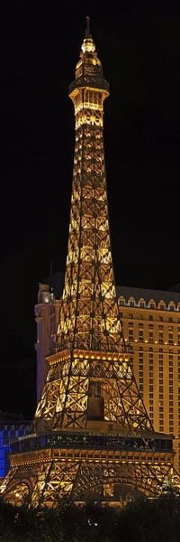 Towers: Replica of the Eiffel Tower lit up at night, Paris Las Vegas, Las Vegas, Nevada, USA by Panoramic Images