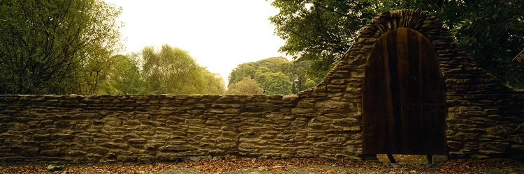 Wooden Door In An Arch Along A Stone Wall, County Kilkenny, Leinster Province, Republic Of Ireland