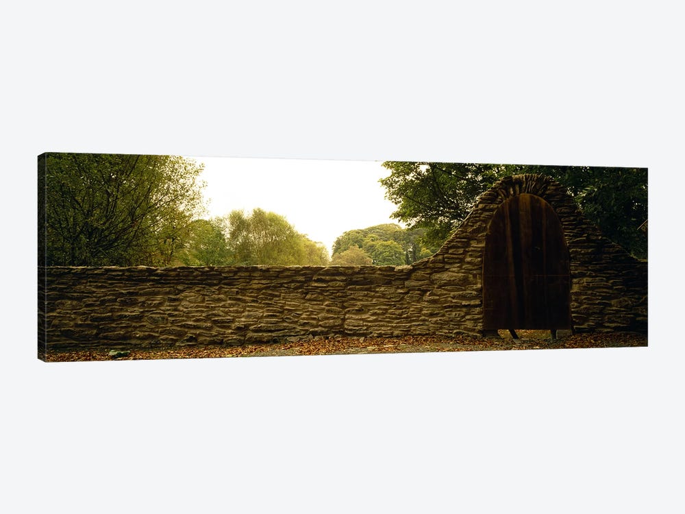 Wooden Door In An Arch Along A Stone Wall, County Kilkenny, Leinster Province, Republic Of Ireland by Panoramic Images 1-piece Canvas Art Print