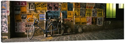 Bicycle leaning against a wall with posters in an alley, Post Alley, Seattle, Washington State, USA Canvas Art Print - Bicycle Art