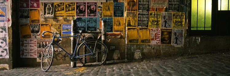 Bicycle leaning against a wall with posters in an alley, Post Alley, Seattle, Washington State, USA