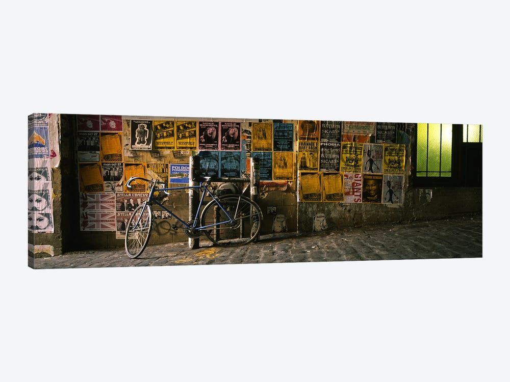 Bicycle leaning against a wall with posters in an alley, Post Alley, Seattle, Washington State, USA by Panoramic Images 1-piece Canvas Art