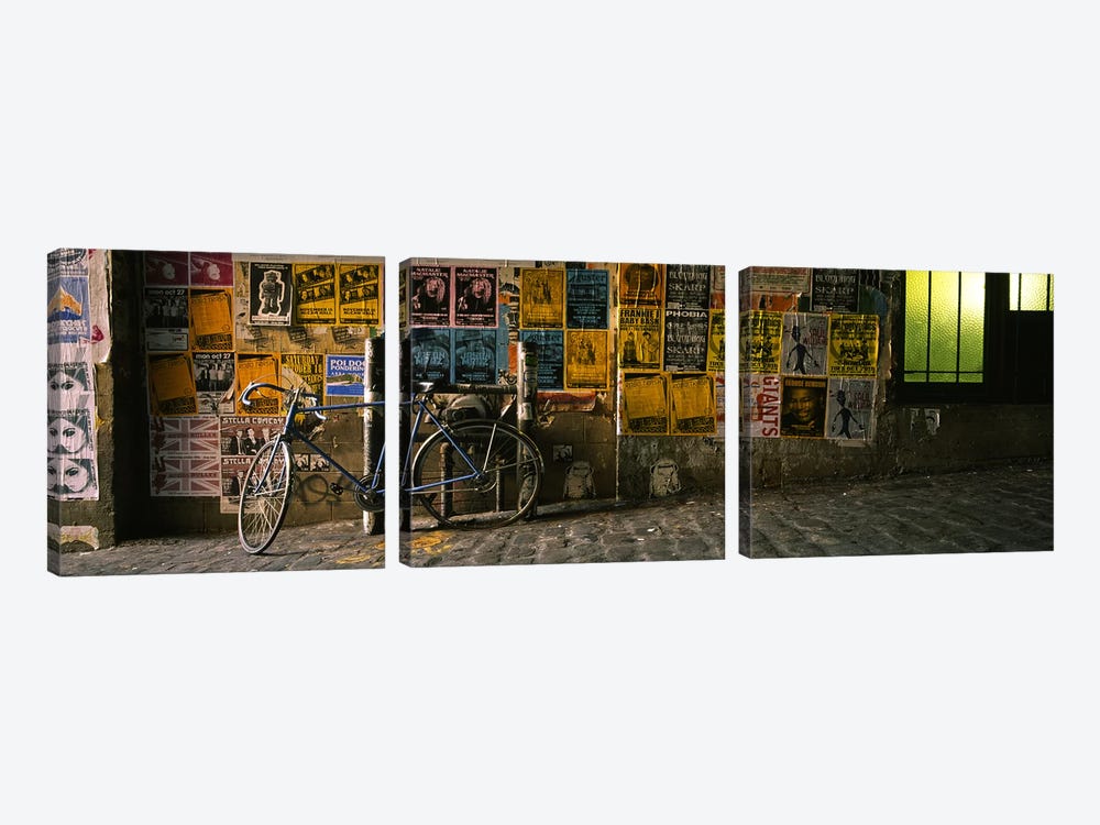 Bicycle leaning against a wall with posters in an alley, Post Alley, Seattle, Washington State, USA 3-piece Canvas Wall Art