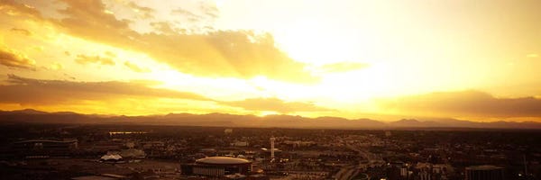 Cloudy Sunsets: Clouds over a cityDenver, Colorado, USA by Panoramic Images