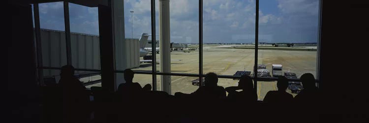 Silhouette of a group of people at an airport lounge, Orlando International Airport, Orlando, Florida, USA