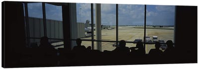 Silhouette of a group of people at an airport lounge, Orlando International Airport, Orlando, Florida, USA Canvas Art Print - Airport Art