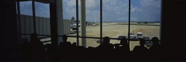 Orlando: Silhouette of a group of people at an airport lounge, Orlando International Airport, Orlando, Florida, USA by Panoramic Images