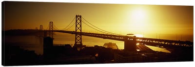 High angle view of a suspension bridge at sunsetBay Bridge, San Francisco, California, USA Canvas Art Print - Lake & Ocean Sunrise & Sunset Art