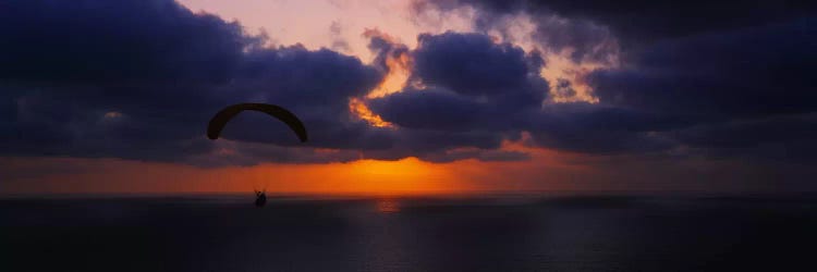 Silhouette of a person paragliding over the sea, Blacks Beach, San Diego, California, USA