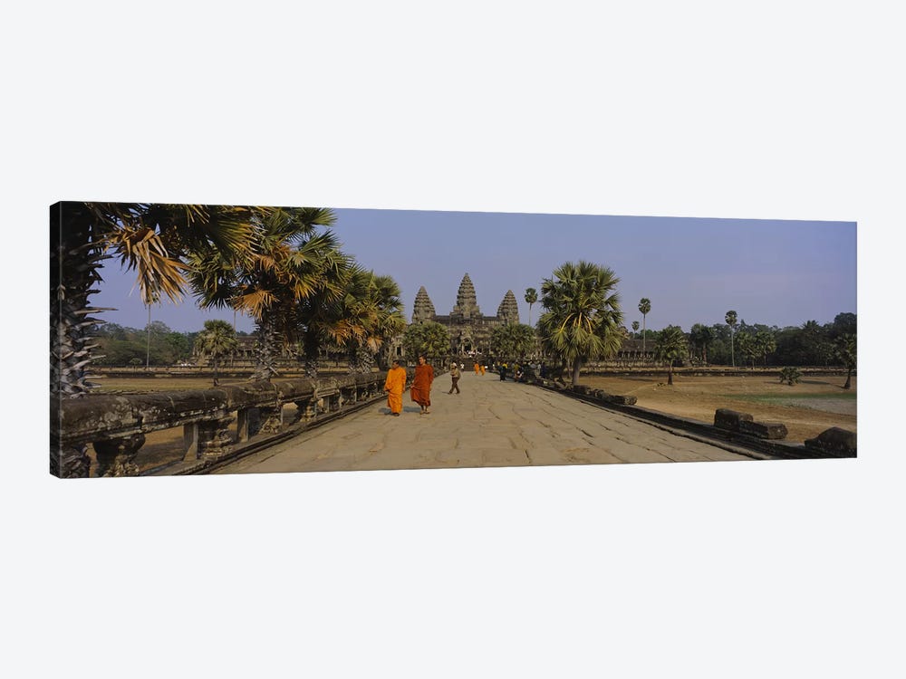 Two monks walking in front of an old temple, Angkor Wat, Siem Reap, Cambodia by Panoramic Images 1-piece Art Print