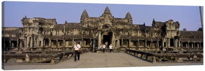 Tourists walking in front of an old temple, Angkor Wat, Siem Reap, Cambodia Canvas Art Print - Wonders of the World