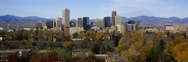 Denver: Skyscrapers in a city with mountains in the background, Denver, Colorado, USA by Panoramic Images