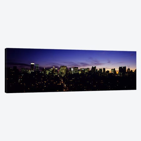 Skyscrapers in a city lit up at night, Manhattan, New York City, New York State, USA Canvas Print #PIM5896} by Panoramic Images Canvas Wall Art