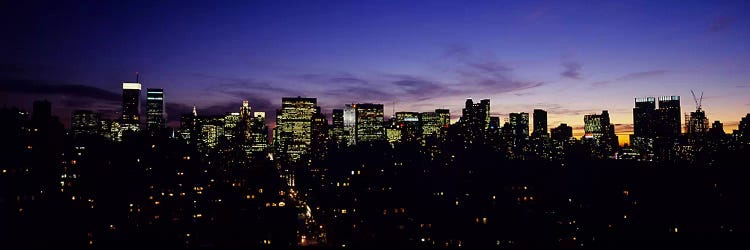 Skyscrapers in a city lit up at night, Manhattan, New York City, New York State, USA