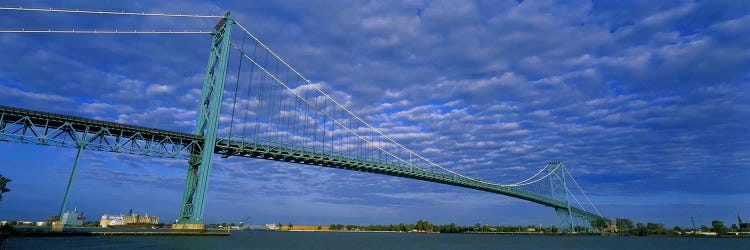 Low angle view of a suspension bridge over the river, Ambassador Bridge, Detroit River, Detroit, Michigan, USA