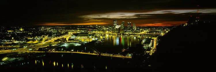 High angle view of buildings lit up at dawnPittsburgh, Pennsylvania, USA