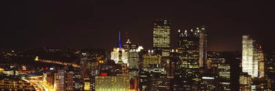 Buildings lit up at night in a cityPittsburgh Pennsylvania, USA by Panoramic Images framed canvas print