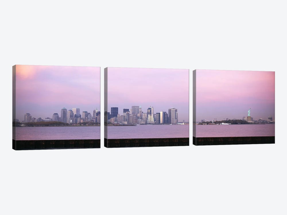 Skyscrapers & a statue at the waterfront, Statue of Liberty, Manhattan, New York City, New York State, USA by Panoramic Images 3-piece Canvas Artwork