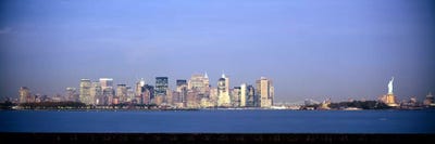 Skyscrapers & a statue at the waterfront, Statue of Liberty, Manhattan, New York City, New York State, USA by Panoramic Images multi panel art