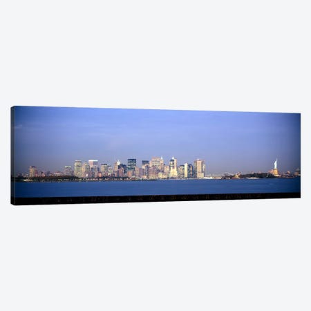 Skyscrapers & a statue at the waterfront, Statue of Liberty, Manhattan, New York City, New York State, USA Canvas Print #PIM6078} by Panoramic Images Canvas Art Print