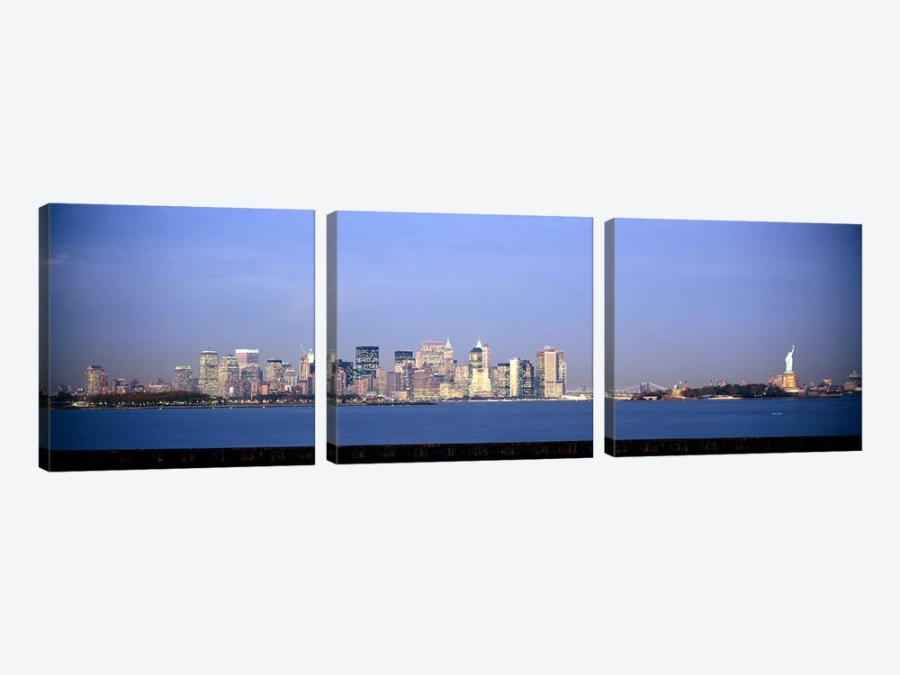 Skyscrapers & a statue at the waterfront, Statue of Liberty, Manhattan, New York City, New York State, USA by Panoramic Images 3-piece Art Print