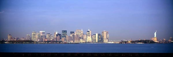 Skyscrapers & a statue at the waterfront, Statue of Liberty, Manhattan, New York City, New York State, USA