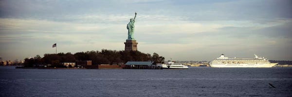 Statue Of Liberty: Statue on an island in the seaStatue of Liberty, Liberty Island, New York City, New York State, USA by Panoramic Images